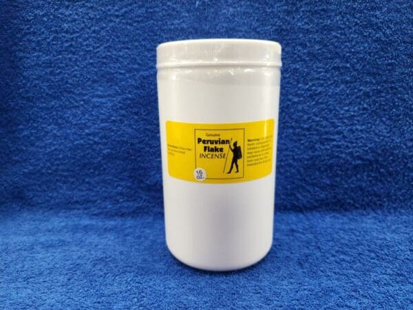 A white container with a yellow label on it.