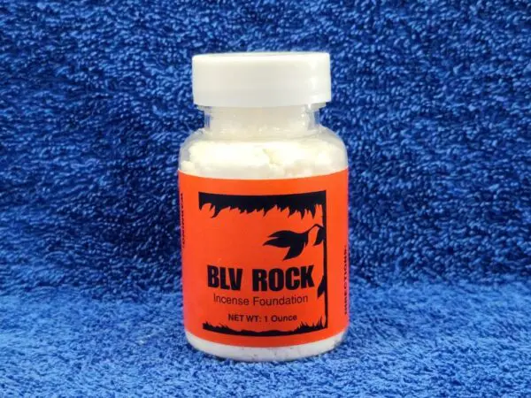 A bottle of buy rock on a blue background.
