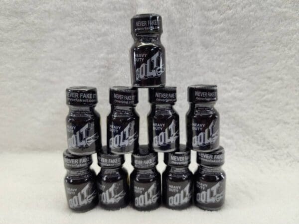 A stack of black bottles stacked on top of each other.