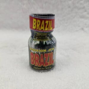 A bottle of brazil coffee on a white surface.