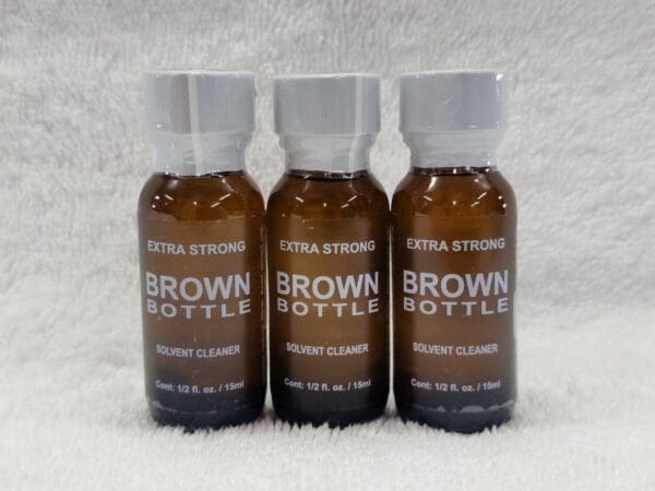 Three bottles of brown bottle on a white background.