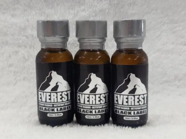 Three bottles of everest black tea on a white background.