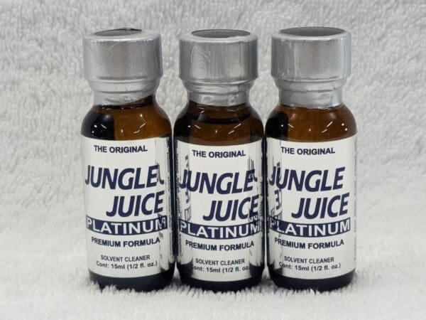 Three bottles of jungle juice on a white background.