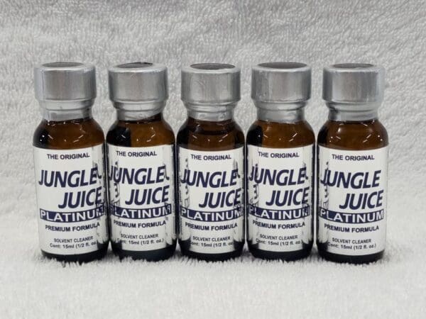 Five bottles of jungle juice on a white background.