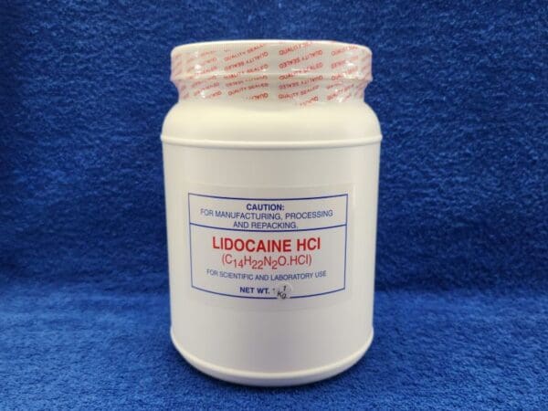 A jar of locacine ii on a blue background.