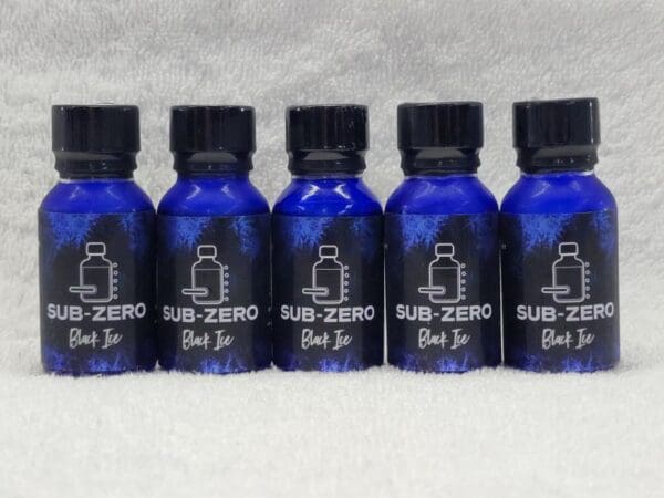 A group of blue bottles with the word sub zero on them.