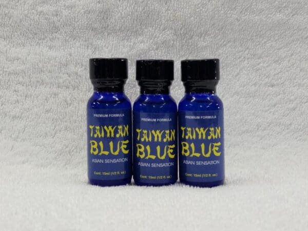 Three bottles of tayam blue on a white background.