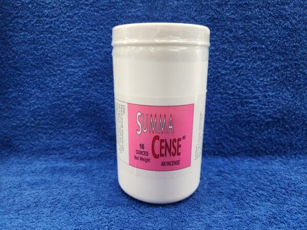 A jar of pink and white powder on a blue background.