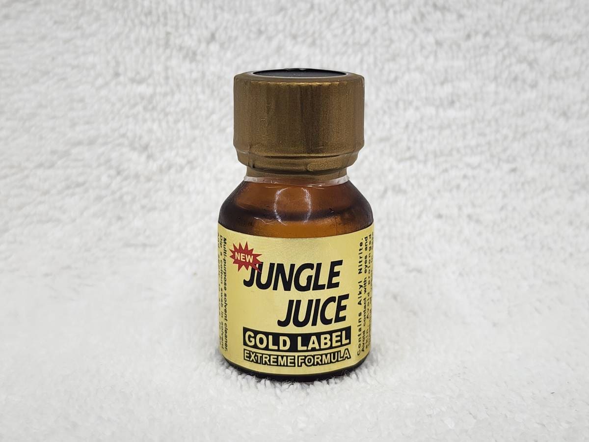 A bottle of gold label jungle juice on the floor