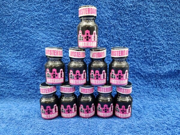 A pyramid of pink and black bottles on a blue background