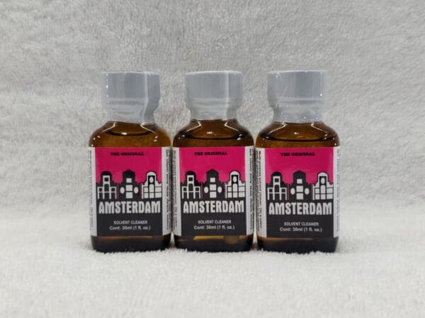 Three bottles of amsterdam liquid on a white background