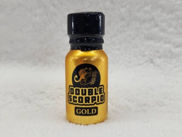 A bottle of double scorpion gold on a white background.