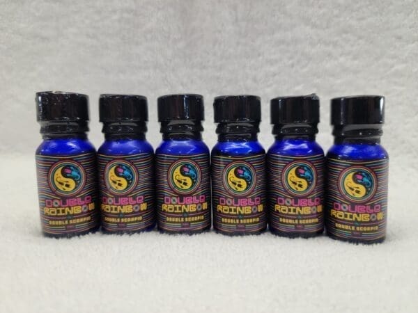 A set of five bottles of cbd oil on a white background.