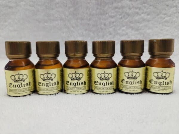 Five bottles of english oil with a crown on top.
