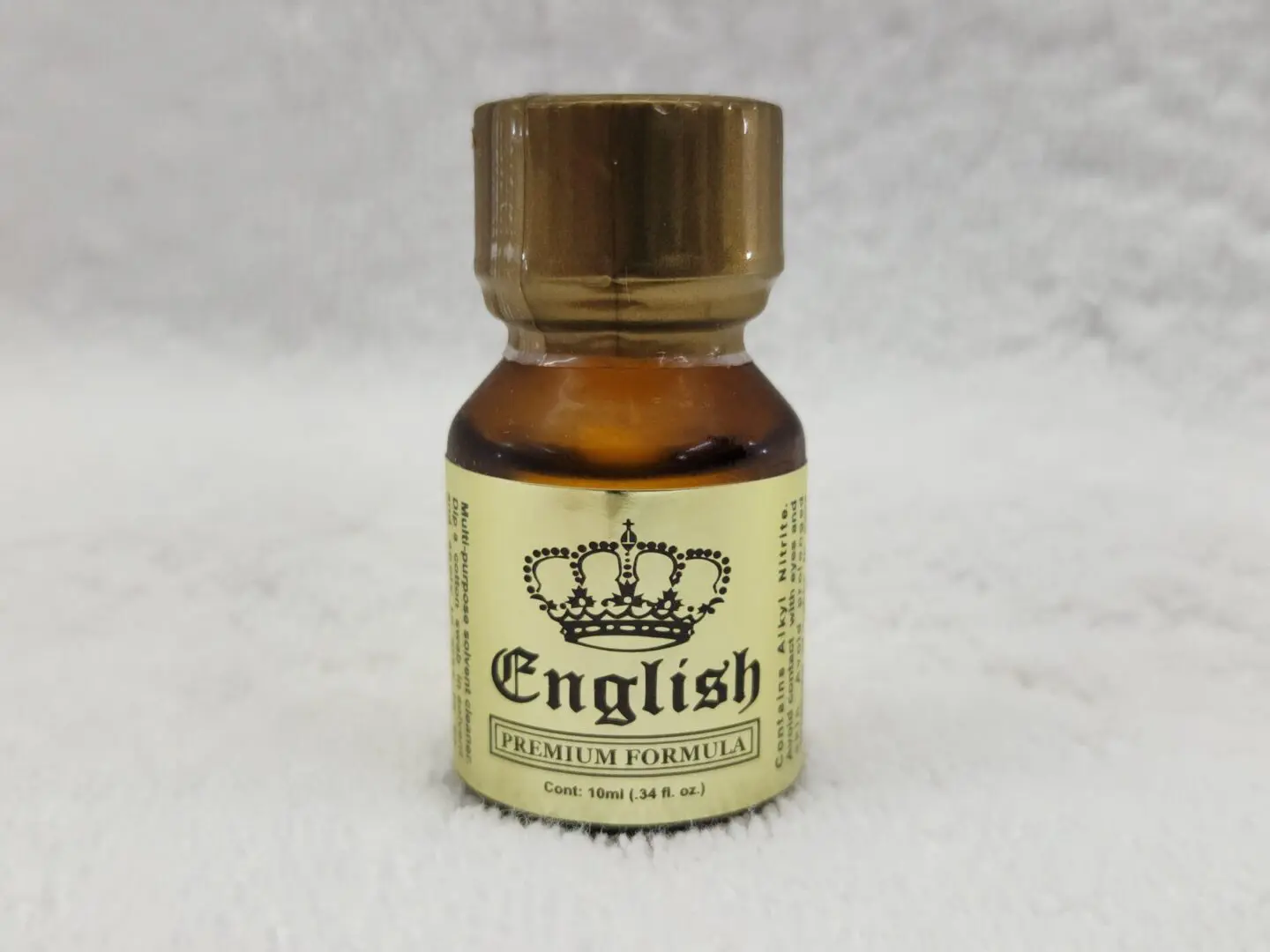 A bottle of english potions on top of white background.