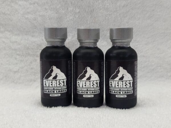 Three bottles of everest black water on a white background