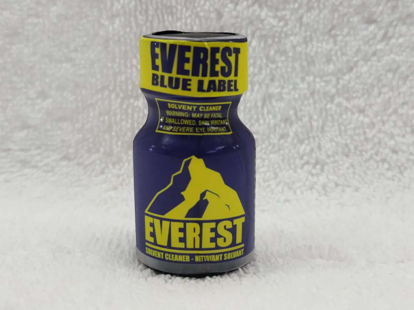 A bottle of everest blue label on a white background.