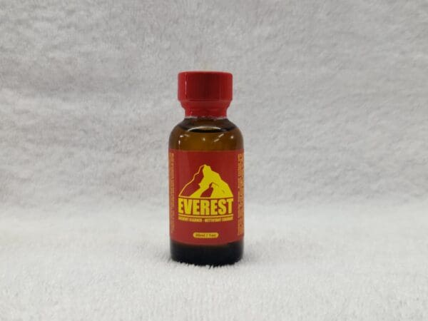 A bottle of everest poppers on the floor