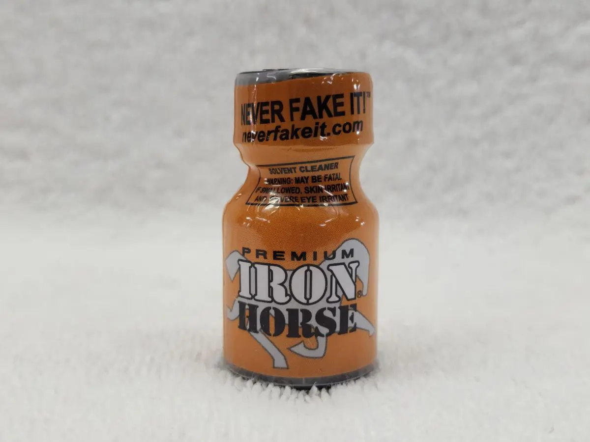 A bottle of Iron Horse on a white surface.