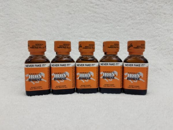 A group of five bottles of orange potions.