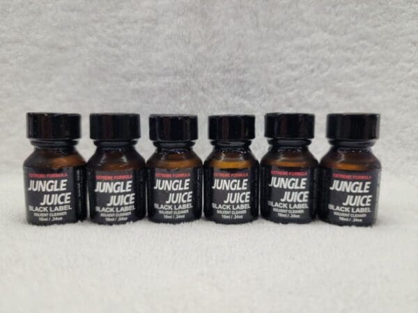 Five bottles of Jungle Juice Black on a white surface.