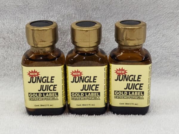 Three bottles of jungle juice on a white background