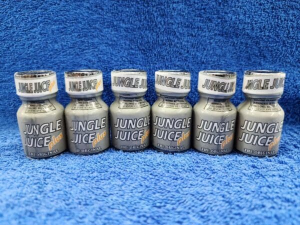 Five bottles of Jungle Juice Plus on a blue background.