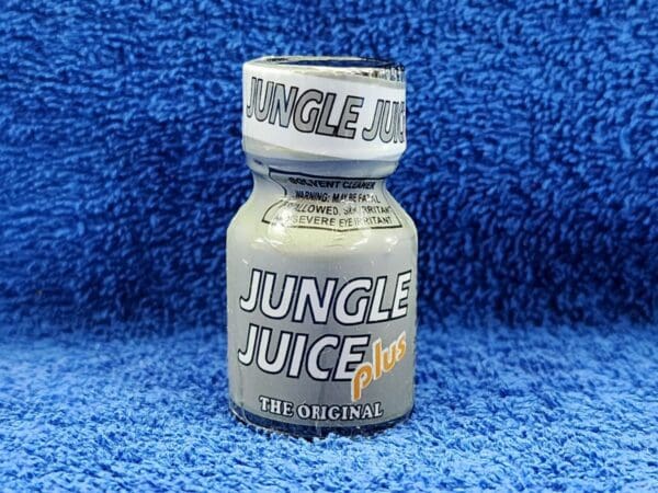 A bottle of Jungle Juice Plus sitting on a blue towel.