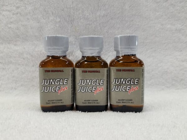 Three bottles of jungle juice are shown on a white background.