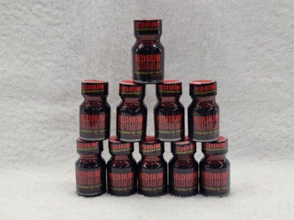 A pyramid of red bottles on top of each other.