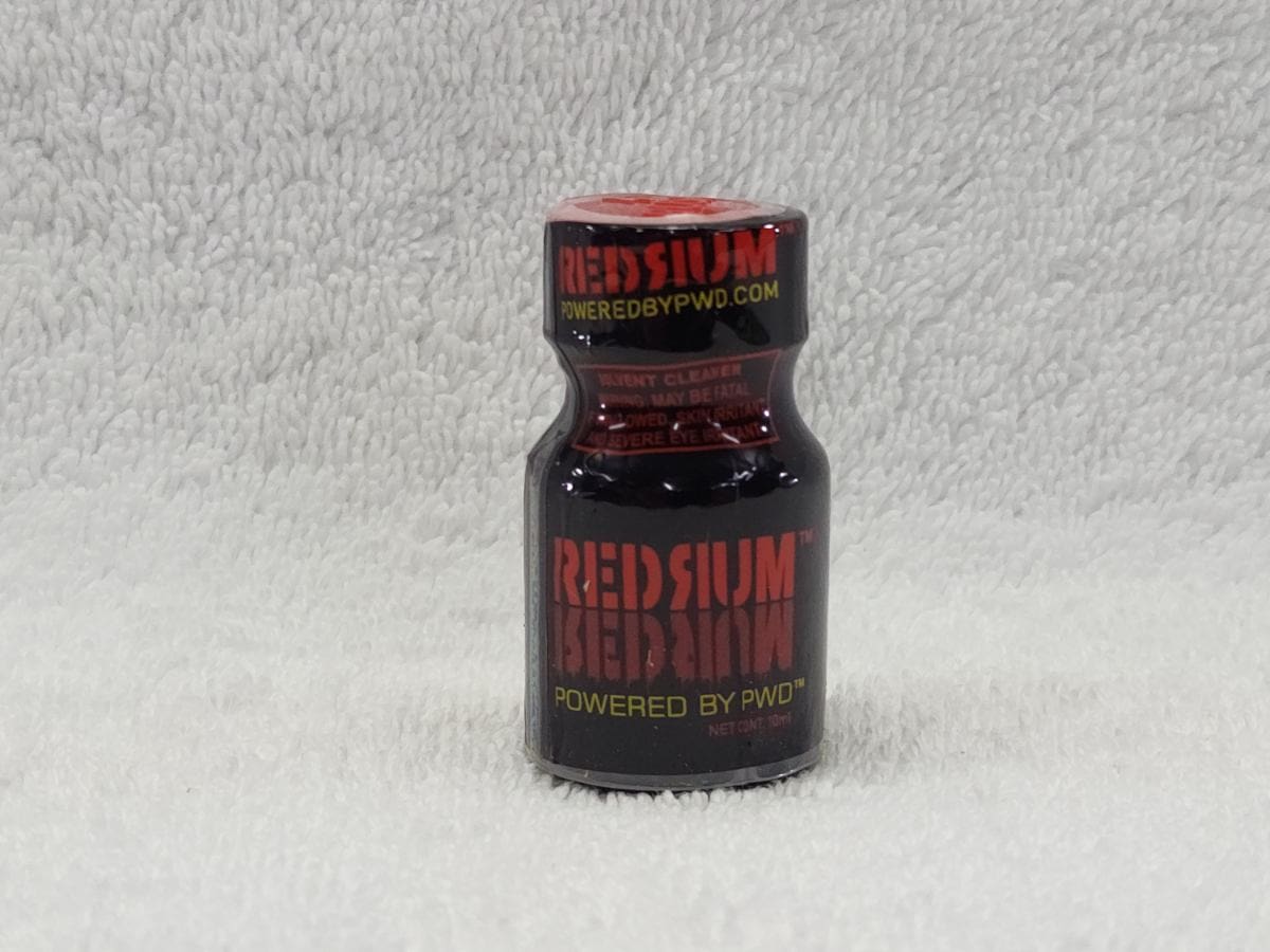 A bottle of red rum flavored poppers