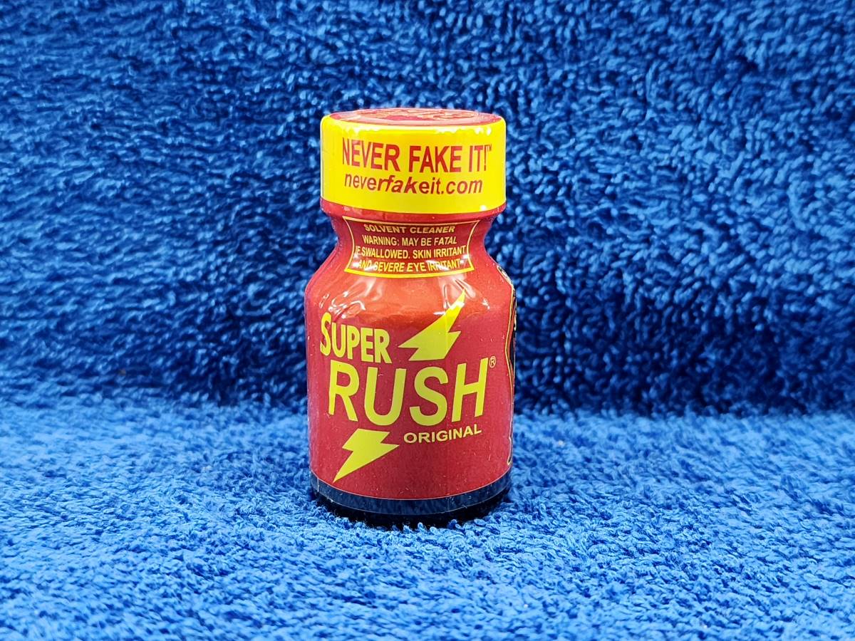 A bottle of super rush on the floor