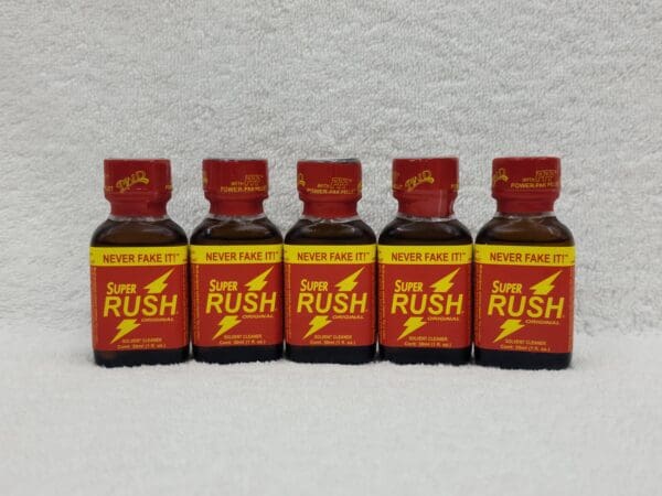 A group of five bottles of rush poppers.