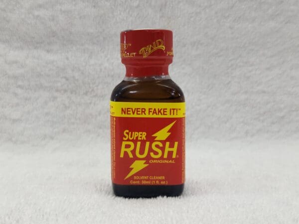 A bottle of super rush is shown on the floor.