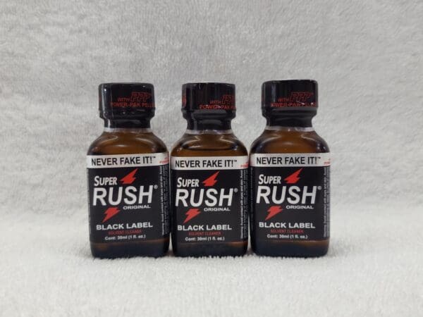 Three bottles of black label rush