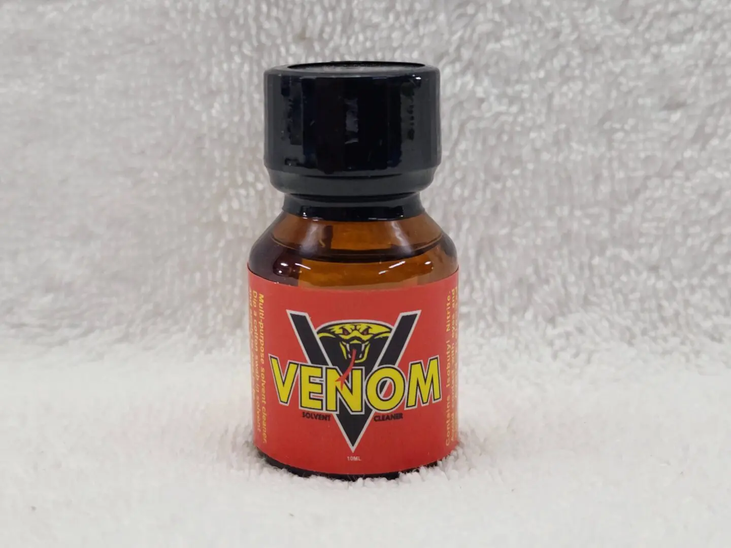 A bottle of venom poppers on the floor