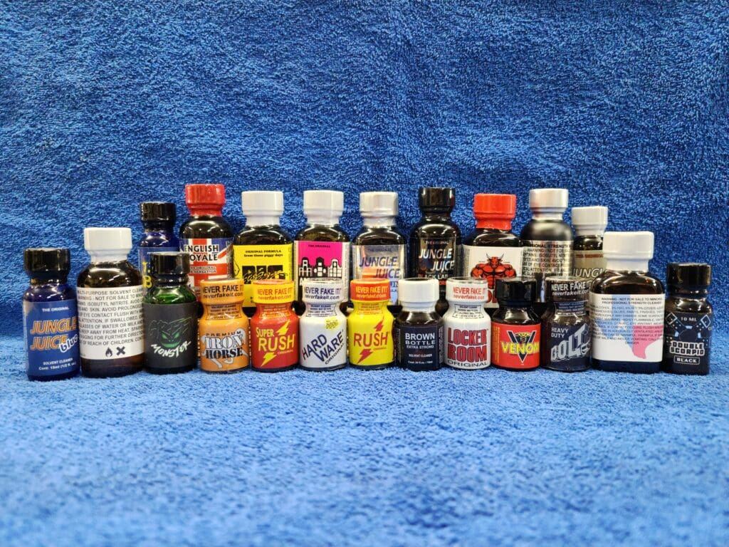A blue blanket with many different bottles of liquid.