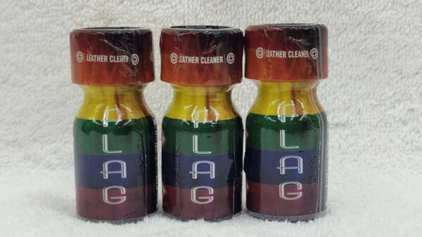 Three bottles of Jolt Coconut with multicolored labels on a white textured background.