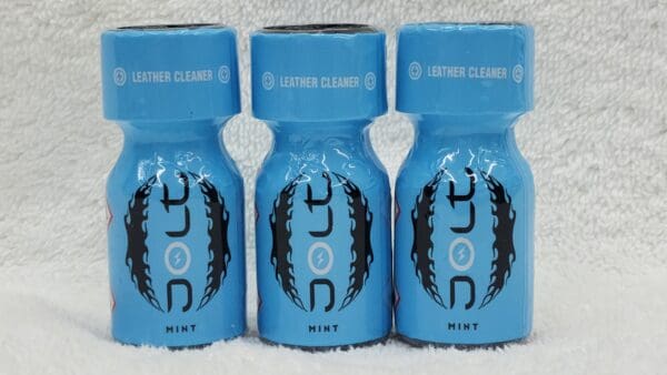 Three bottles of Jolt Coconut-scented leather cleaner with blue caps, lined up against a white background.