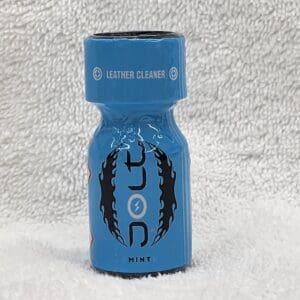 A blue bottle of Jolt Coconut leather cleaner labeled "mint" on a white textured surface.