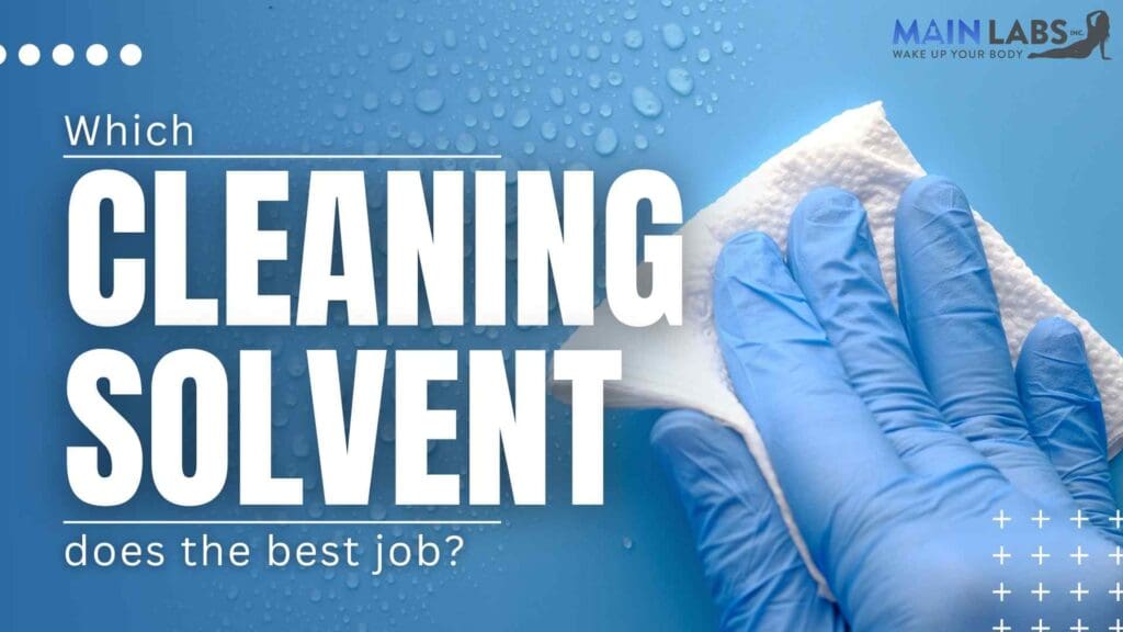 Promotional image for main labs featuring a person's hands wearing blue gloves, text asking "which cleaning solvent does the best job?" on a blue background with water droplets.